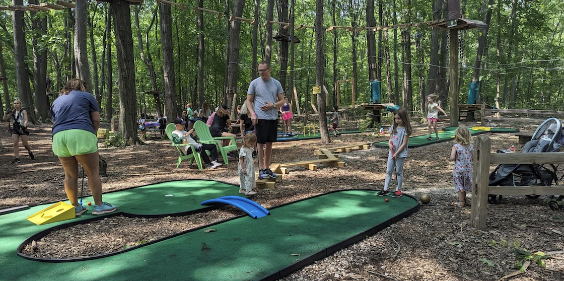 TreeRunner Adventure Parks mini golf course with family putting
