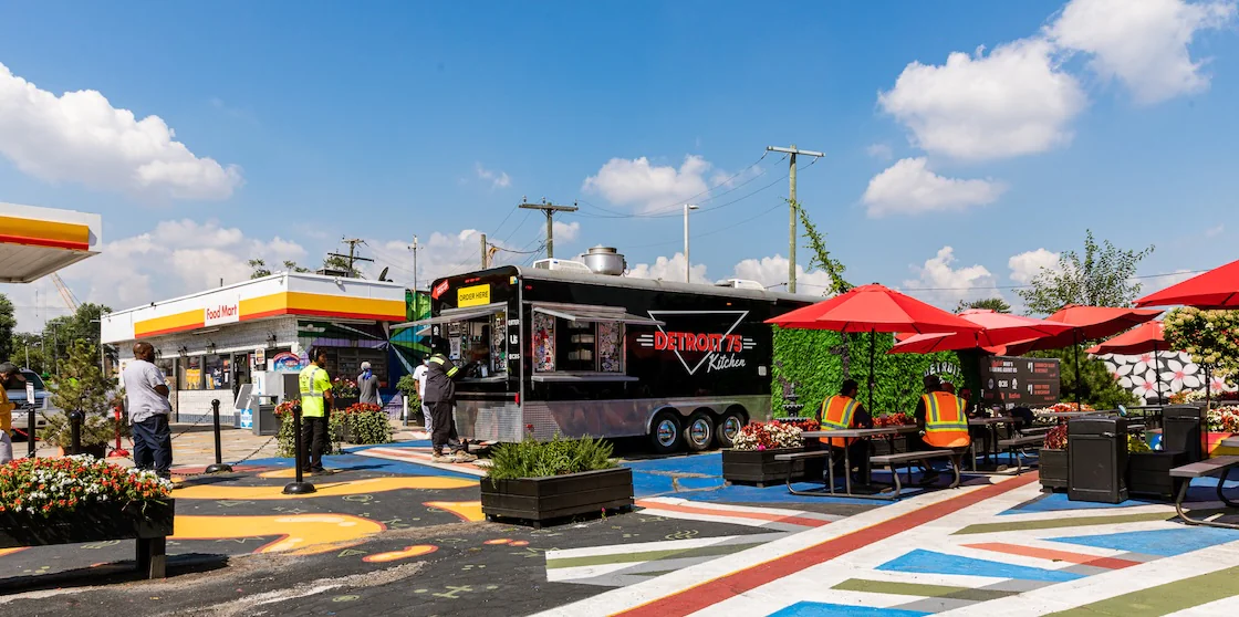 Detroit 75 Kitchen's original food truck + patio space outside a gas station