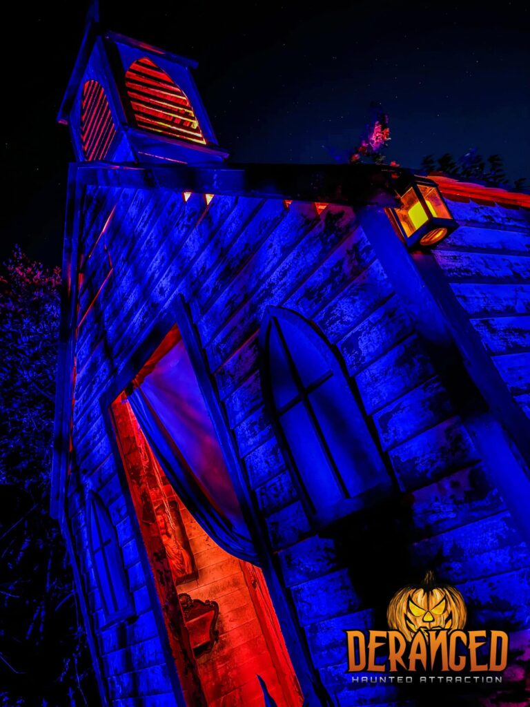 deranged haunted attraction glowing building