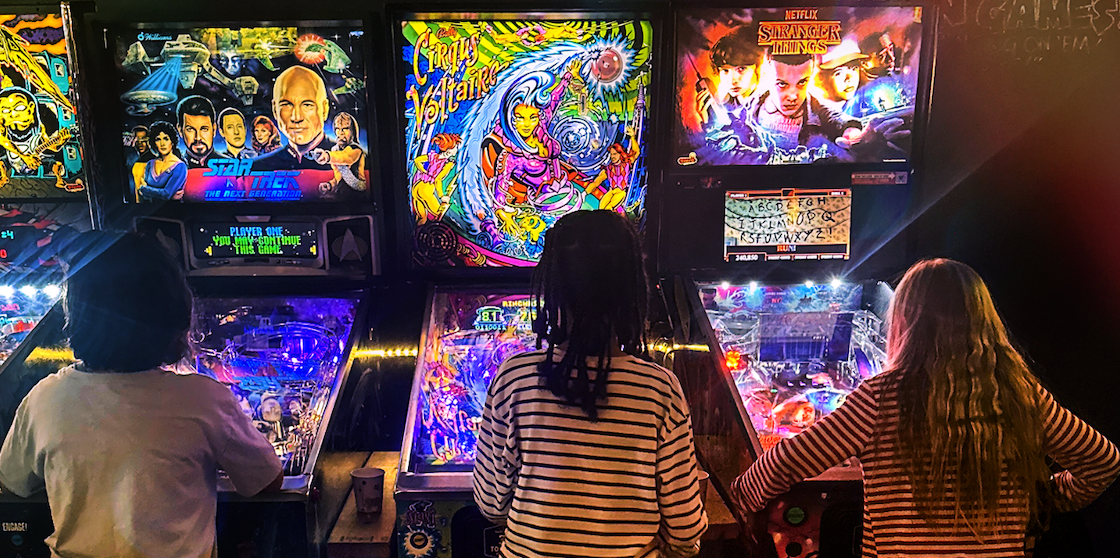 Barcade - kids playing pinball and arcade games inside Barcade on family day