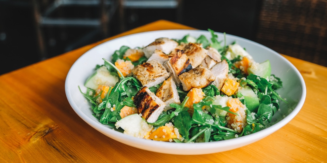 salad from anita's kitchen with chicken, greens, and seasonal ingredients