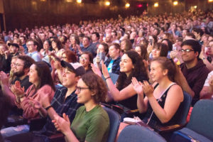 Audience at film festival applauding