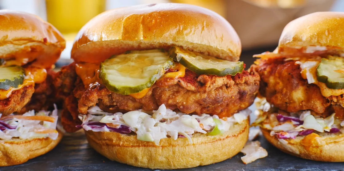 spicy nashville hot chicken sandwich with coleslaw and pickles