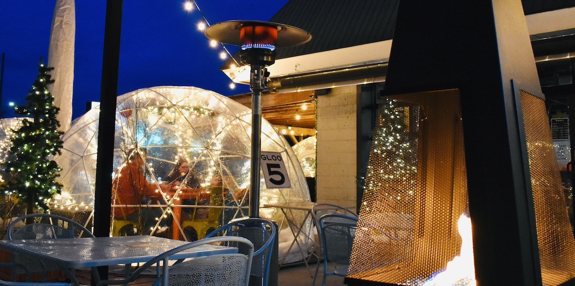 detroit fleat's patio with an igloo, heater, and lights