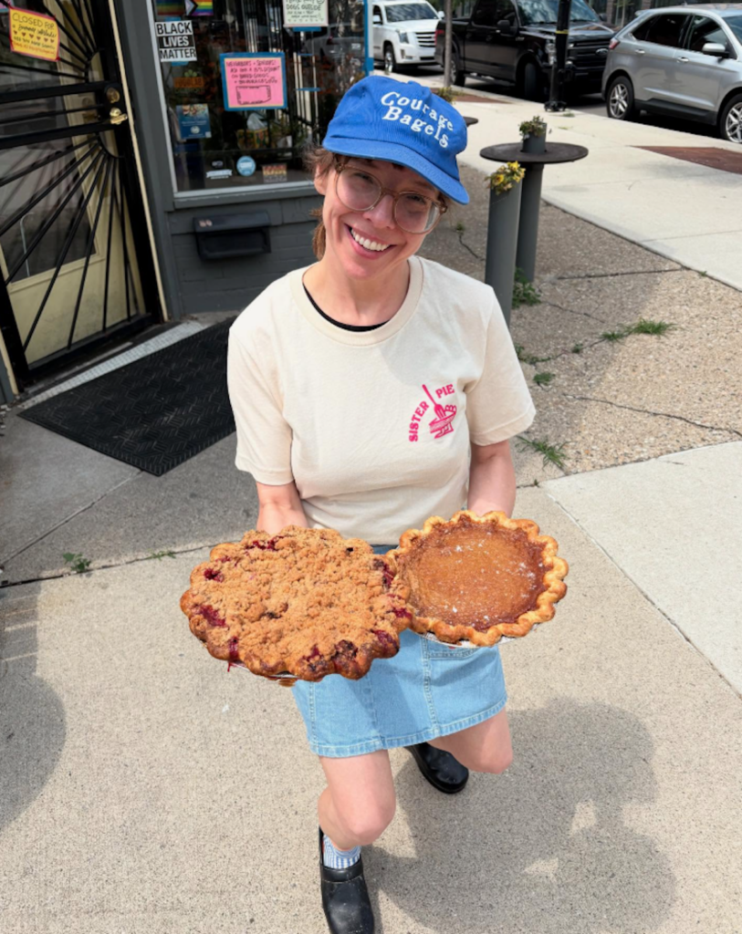 Owner Lisa of West Village's Sister Pie holding two pies