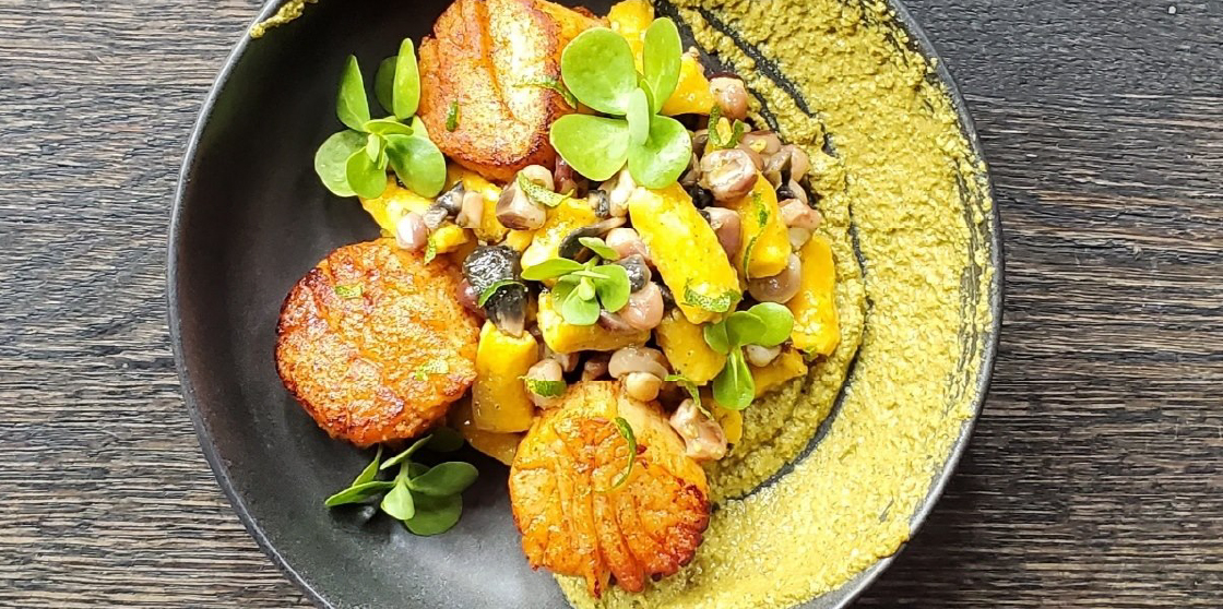 Sea Scallops served with Local Pumpkin Gnocchi, Heirloom Hominy, Huitlacoche, Mole Verde, and Verdolagas from Wright & Company