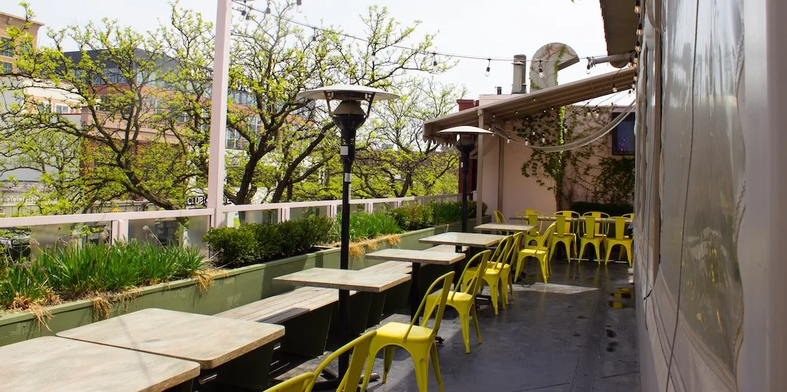 Outdoor dining space on Bella Limone's rooftop patio