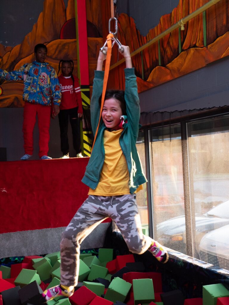 boy zip lining at zap zone - adventure parks