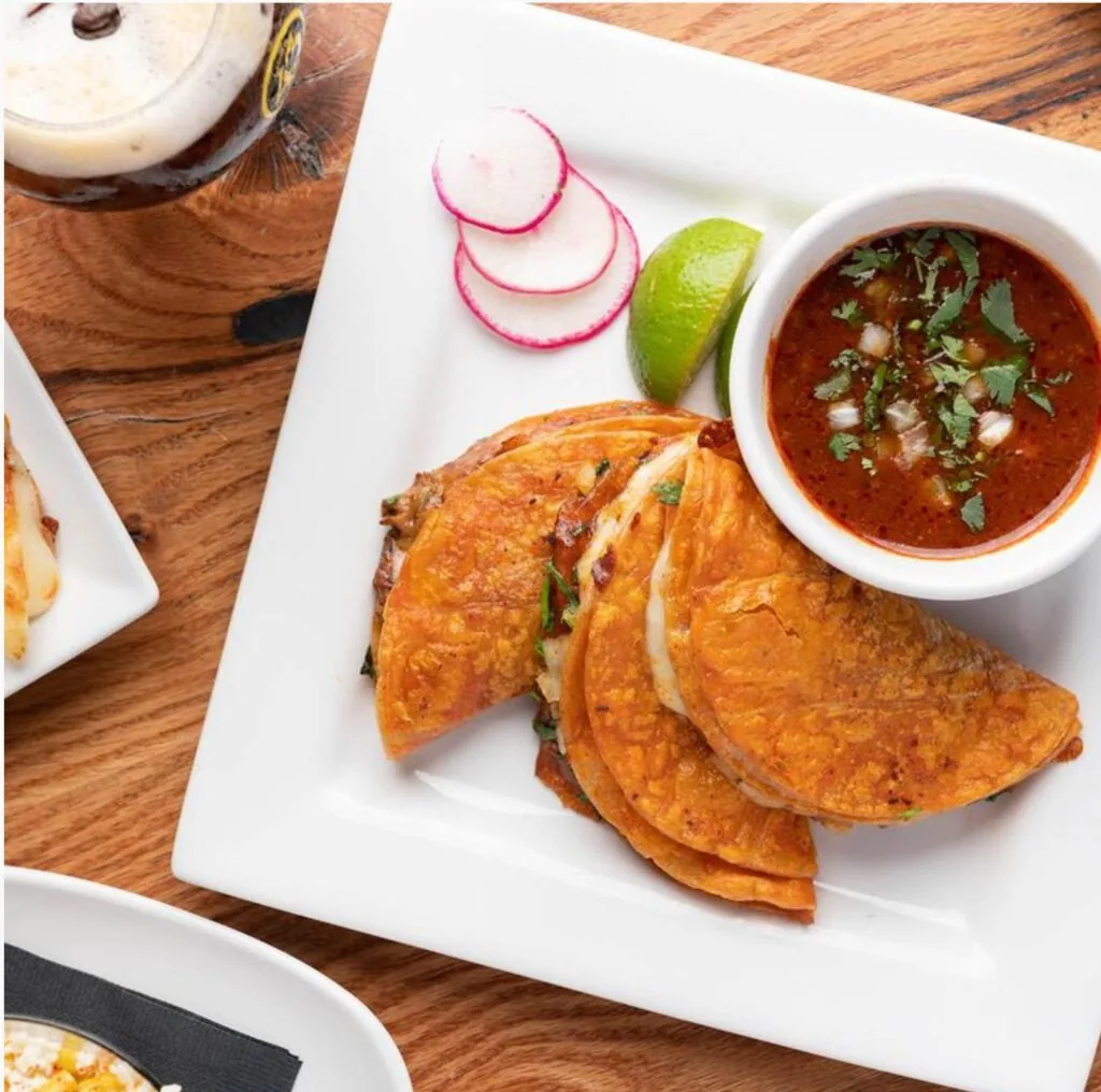 tacobirria from mezcal with cup of consomme