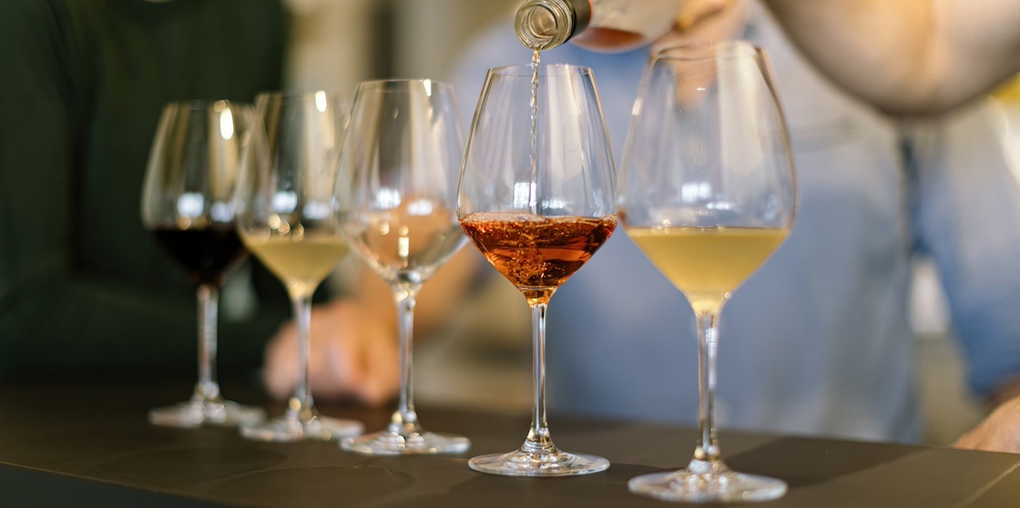pouring wine on glasses - wine bars preparing wine tasting