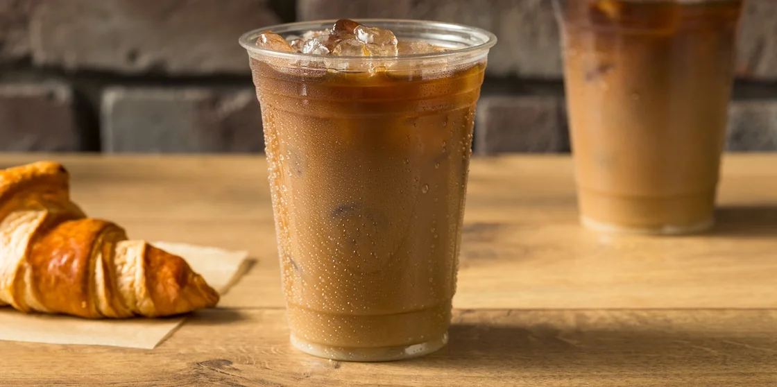 Sweet Iced Almond Milk Coffee in a To Go Cup - coffee shops