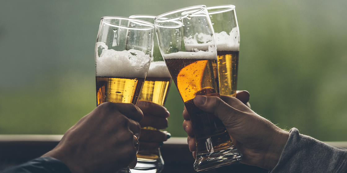 four glasses of beer raising a toast - fall beers