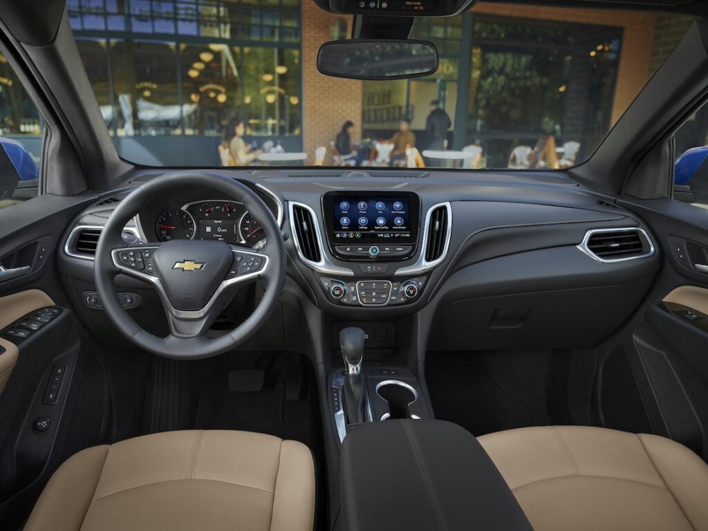 Front interior of the Chevy Equinox with tan seats and black dashboard