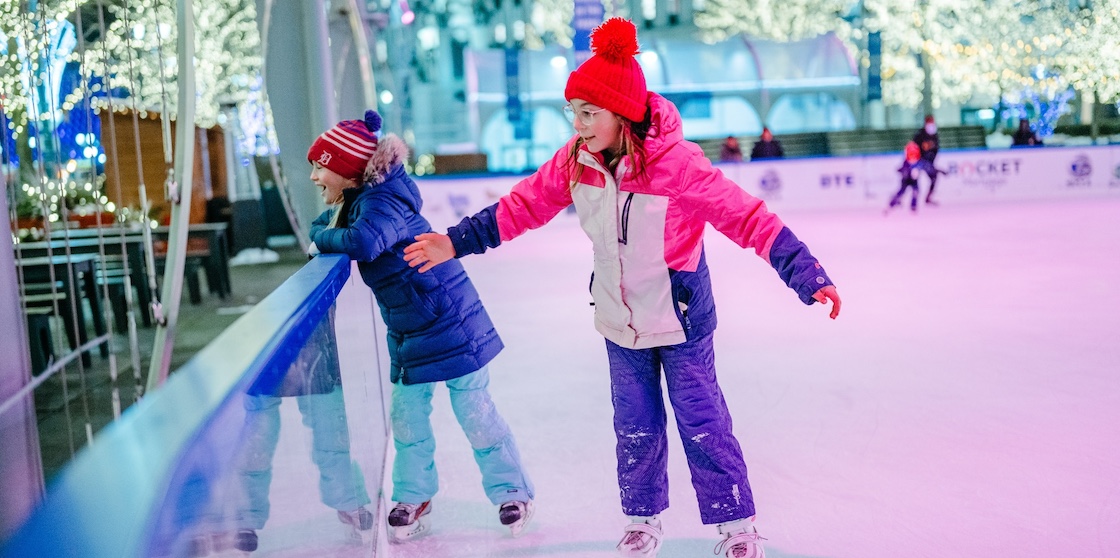 two children at the Campus Martius ice rink