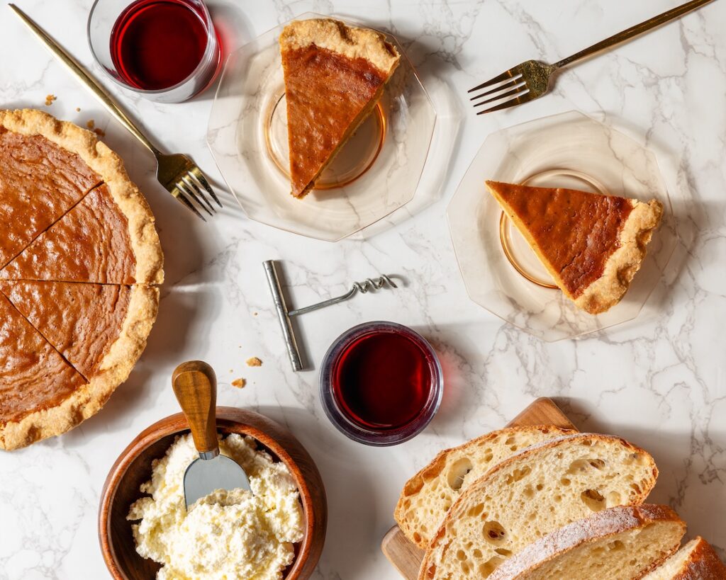slices of pumpkin pie, bread, butter, and wine from FOLK detroit
