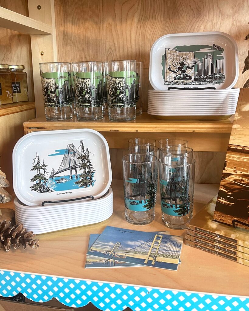 peninsulas display for spirit of detroit and the mackinac bridge with glasses and trays - local boutiques