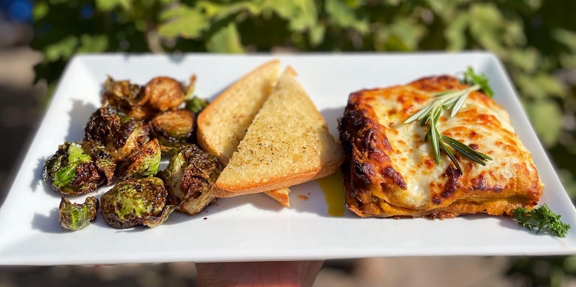 pumpkin lasagna with brussels sprouts and garlic bread from seva