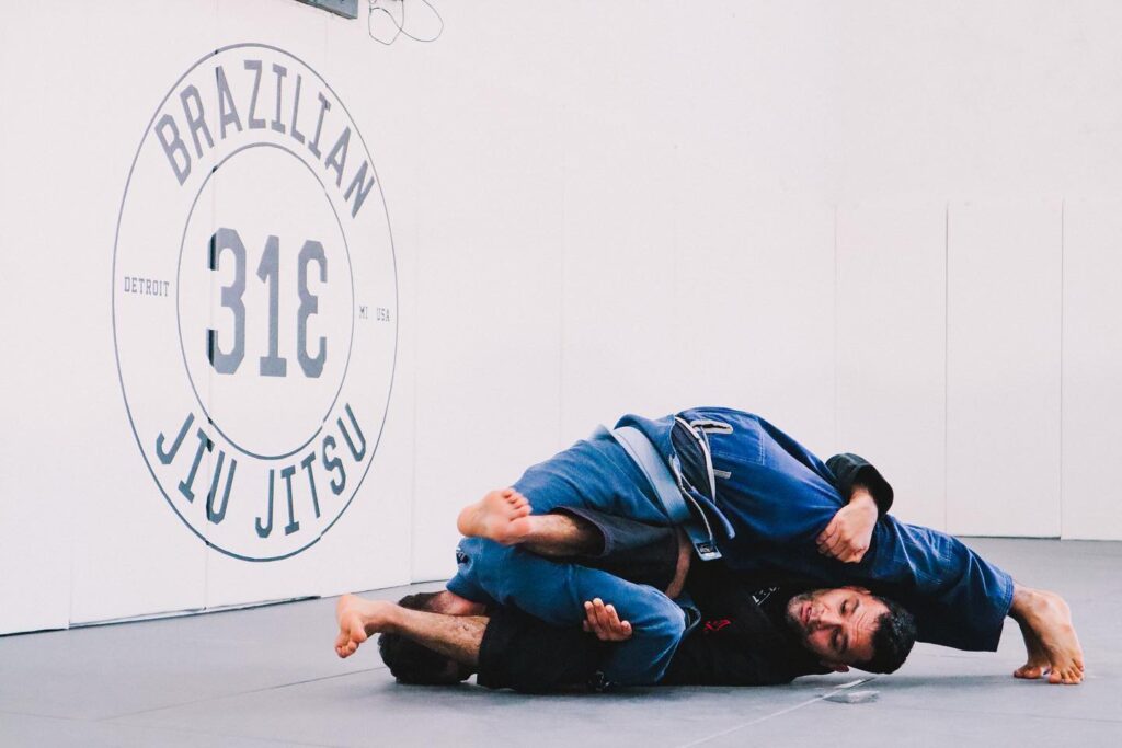 two men practicing jiu-jitsu at 313 Brazilian
