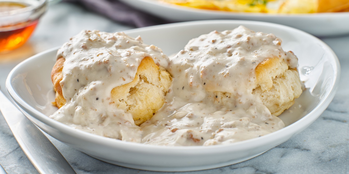 biscuits and gravy with sausage on plate