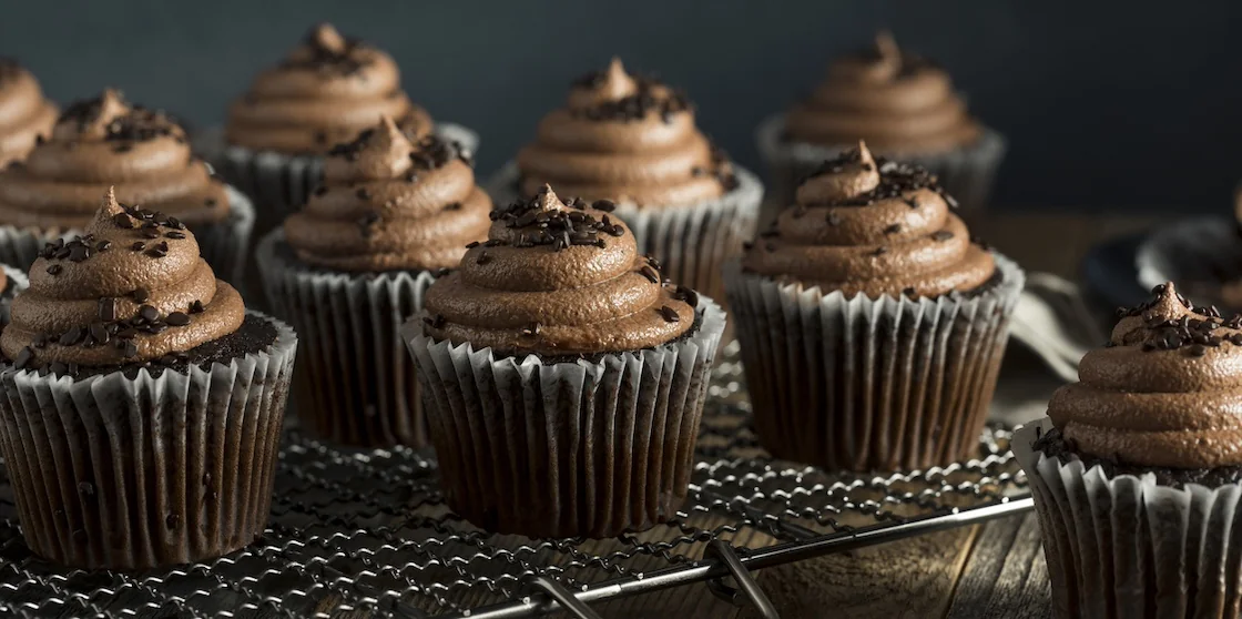 Homemade Sweet Chocolate Cupcakes with Dark Frosting on Top