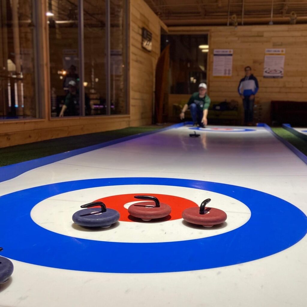 curling lanes at axe social with two players mid game