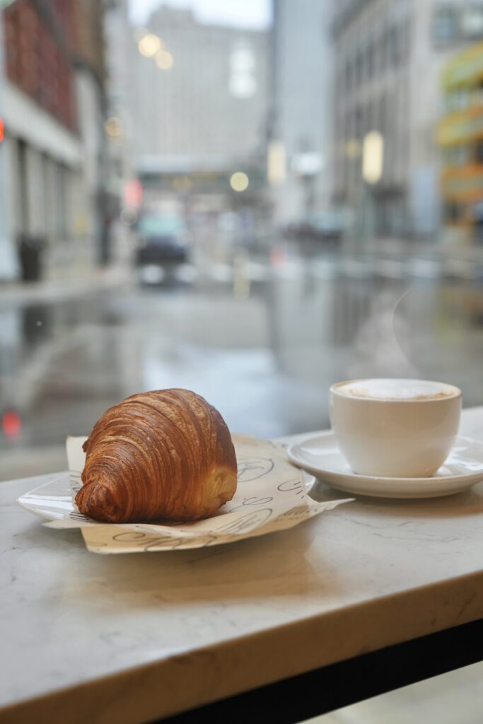 croissant and latte in the window of Cannelle by Matt Knio photographed by Cat Sareini