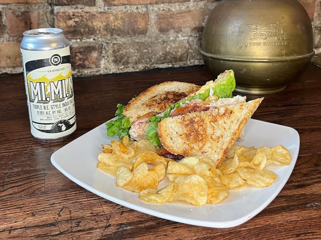 grand trunk pub club car sandwich with potato chips and a canned beverage - lunch specials