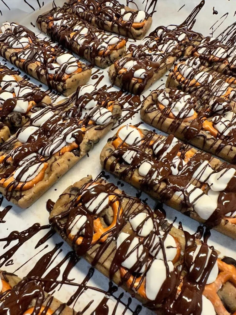 doughbar's doughbars with cookie dough, pretzels, marshmallows, and chocolate sauce