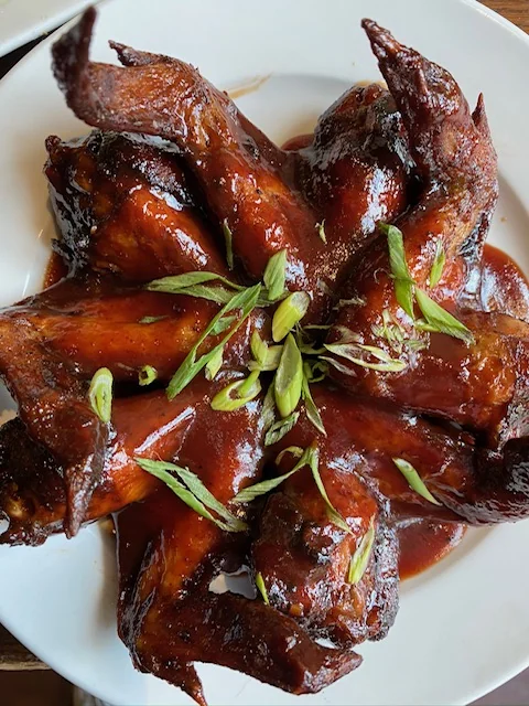 the block wings with green onions