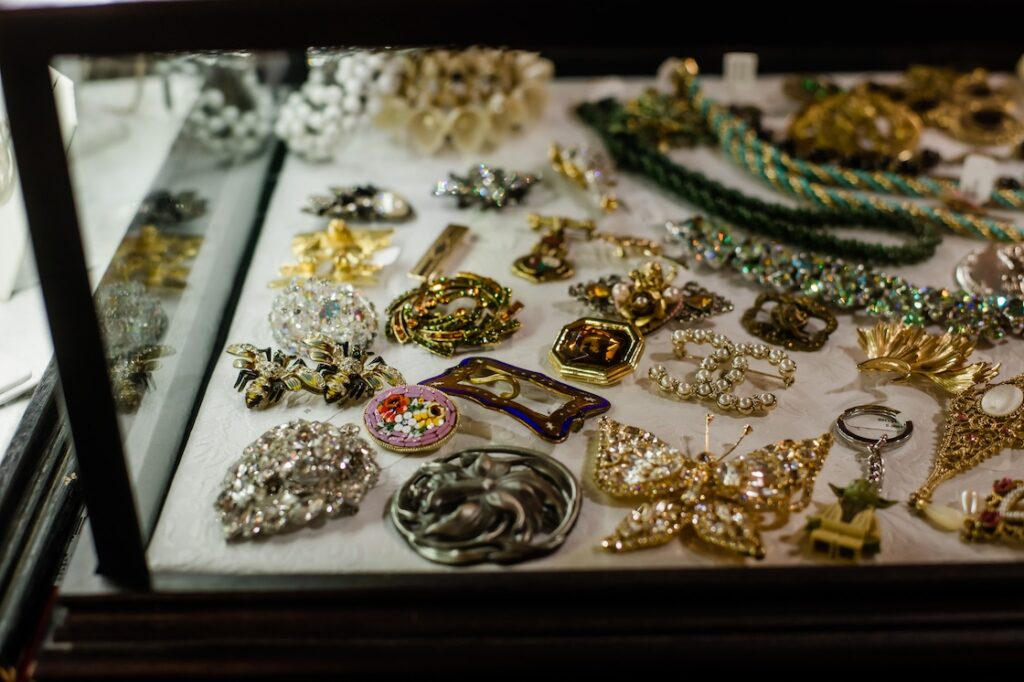 michigan antique festival display case of brooches - spring events