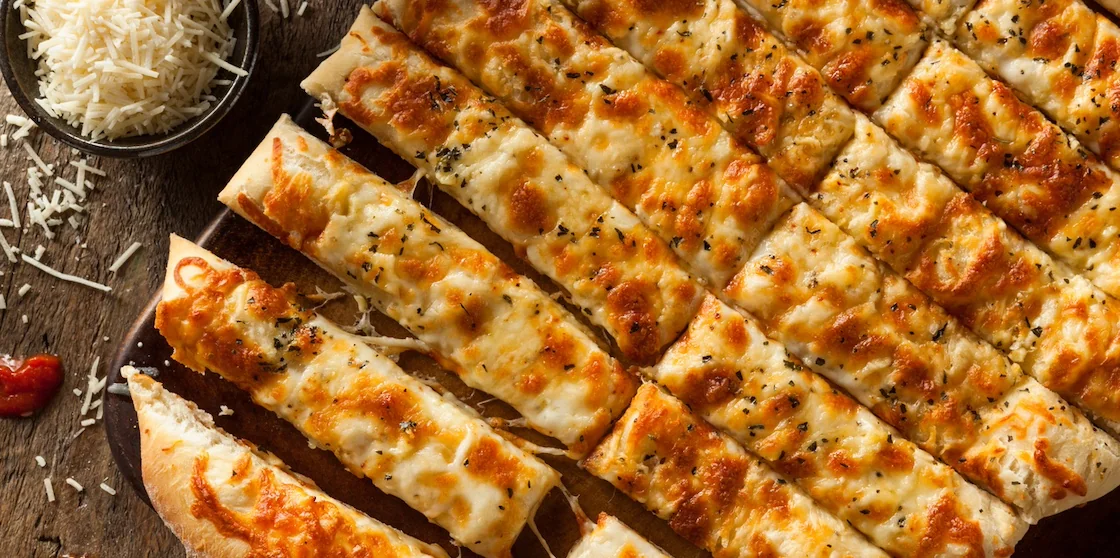 Homemade Cheesy Garlic Bread sticks with Marinara Sauce for Dipping