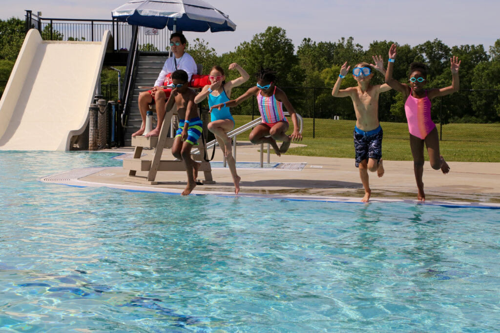 kids jumping into the pool at Willow Metropark