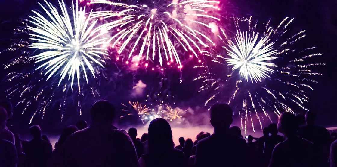 Crowd watching fireworks and celebrating