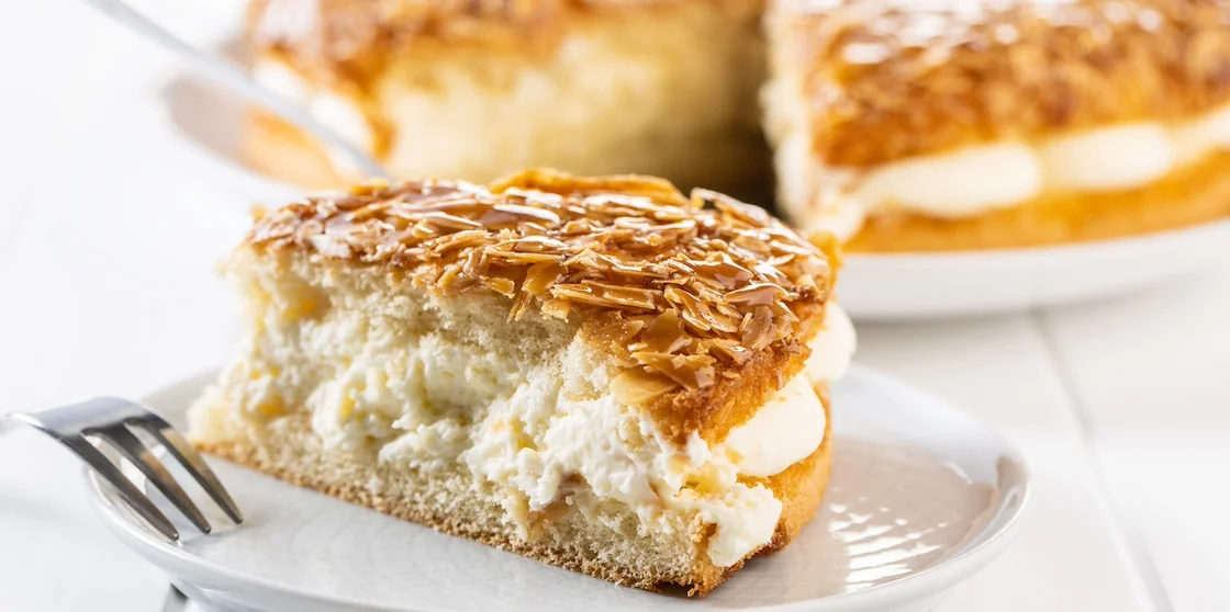 Piece of bee sting honey cake on plate