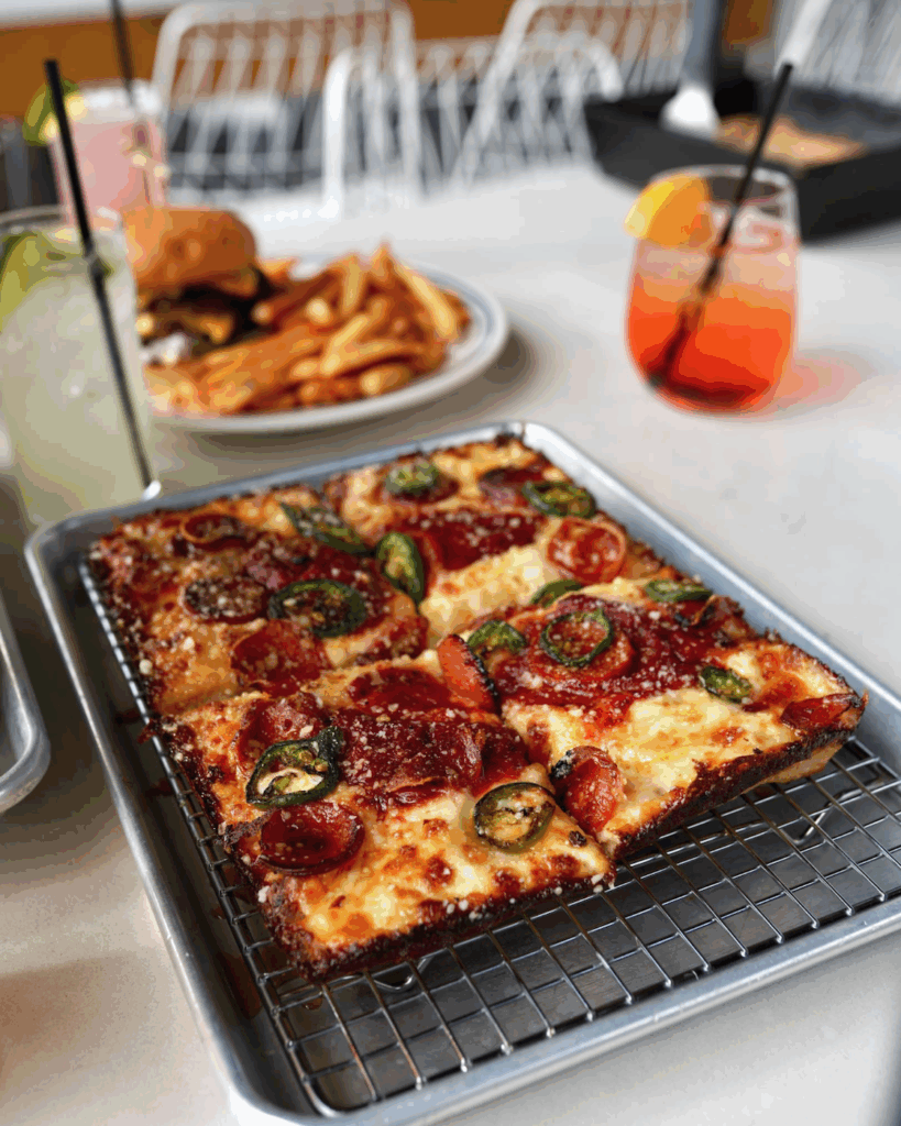 Joshua J pizza from Como's with hot honey