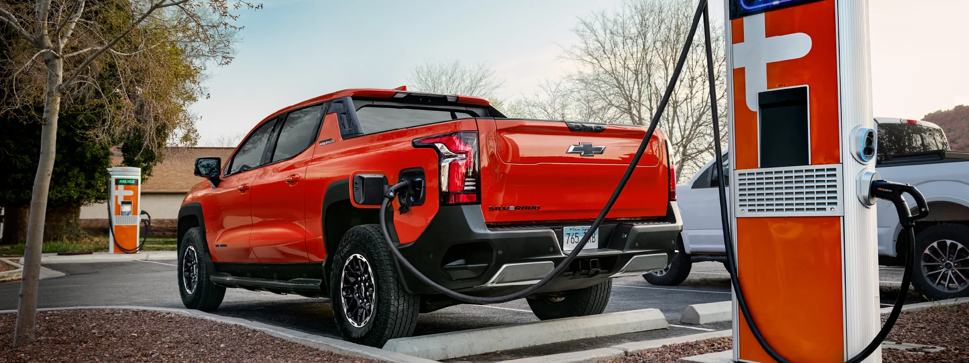 orange Silverado EV trailboss charging