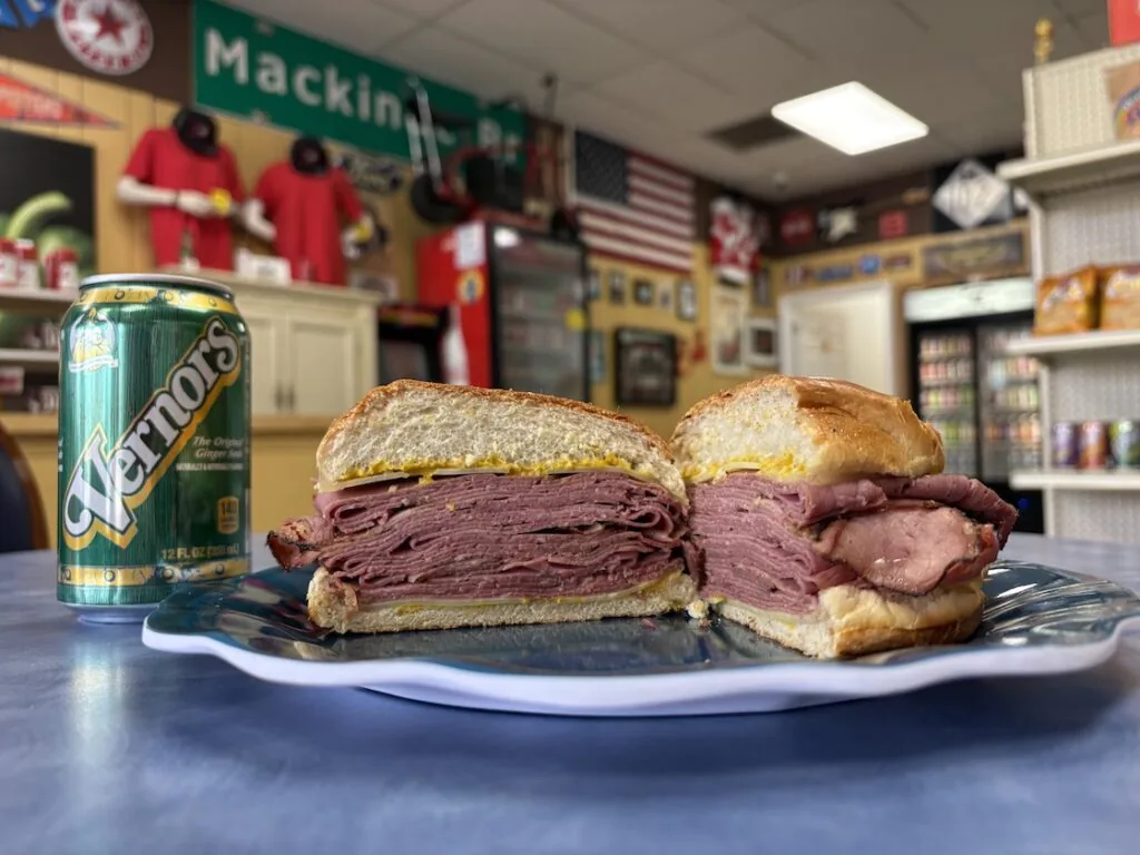 stacked deli sandwich with Vernors from Mid Eight Sandwich Shop