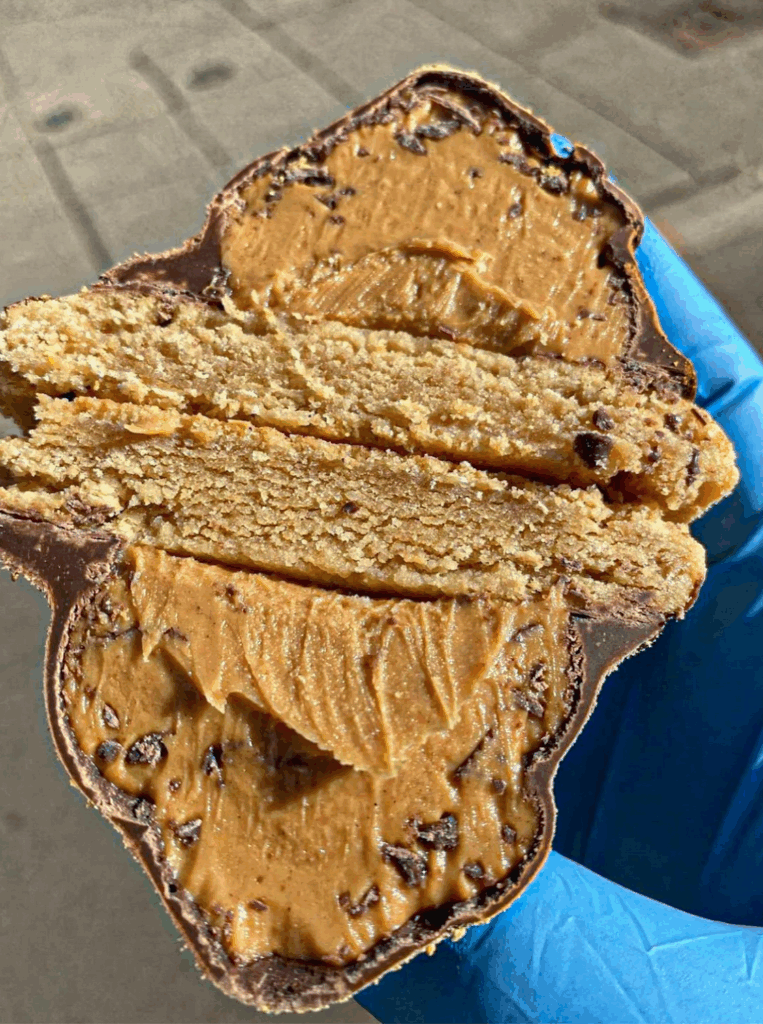 Detroit Cookie Co's Peanut Butter Volcano cookie cut in half