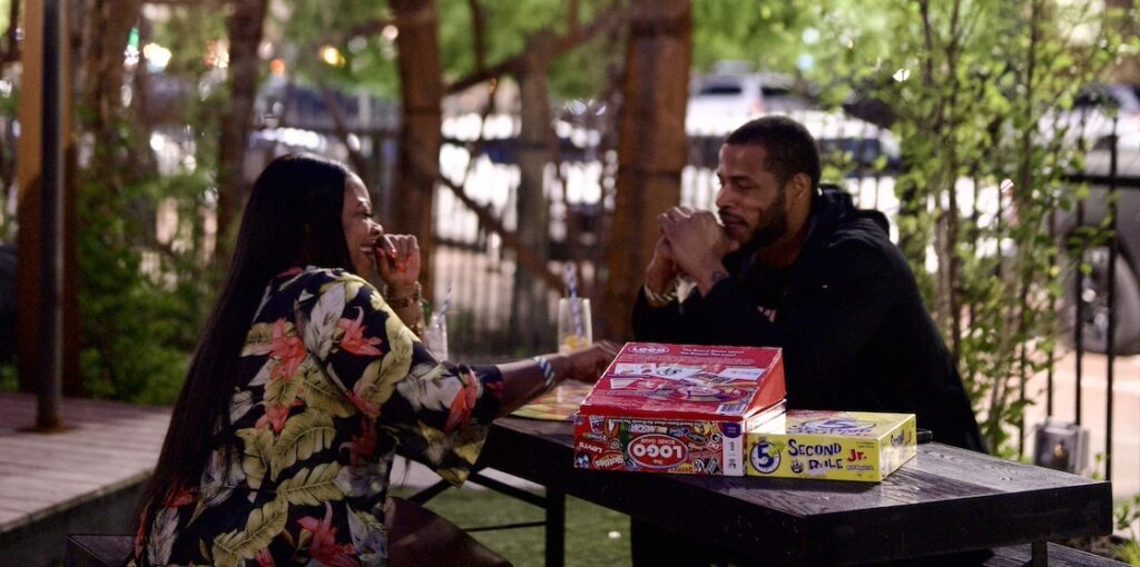 Couple on the outdoor patio at The Yard at Corktown