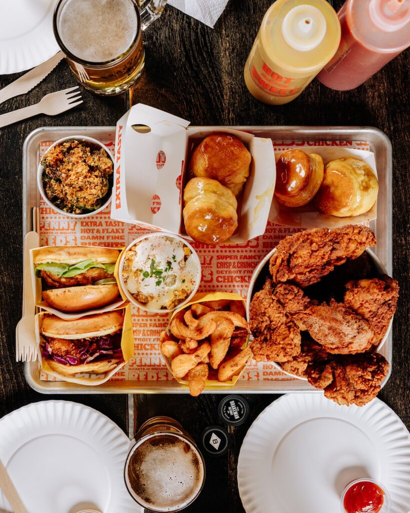 aerial view of chicken, sandwiches, sides, and biscuits from Penny Red's