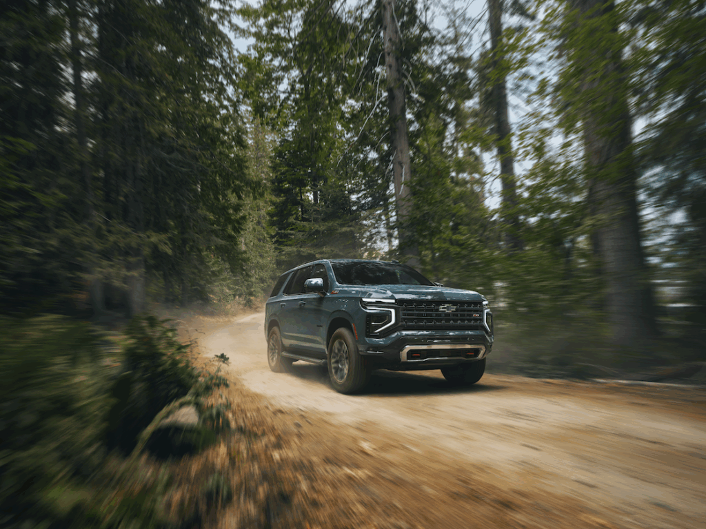 Cypress Green Tahoe Z71 Trim traveling on a dirt road