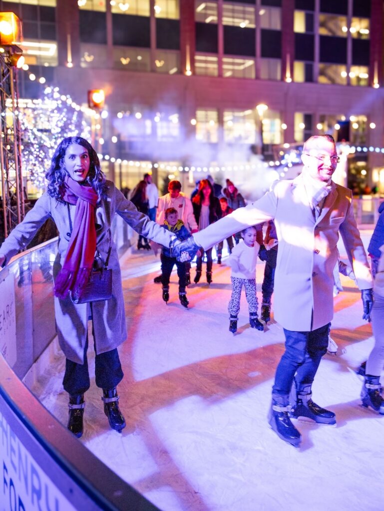 Couple ice skating at The Rink at Royal Oak