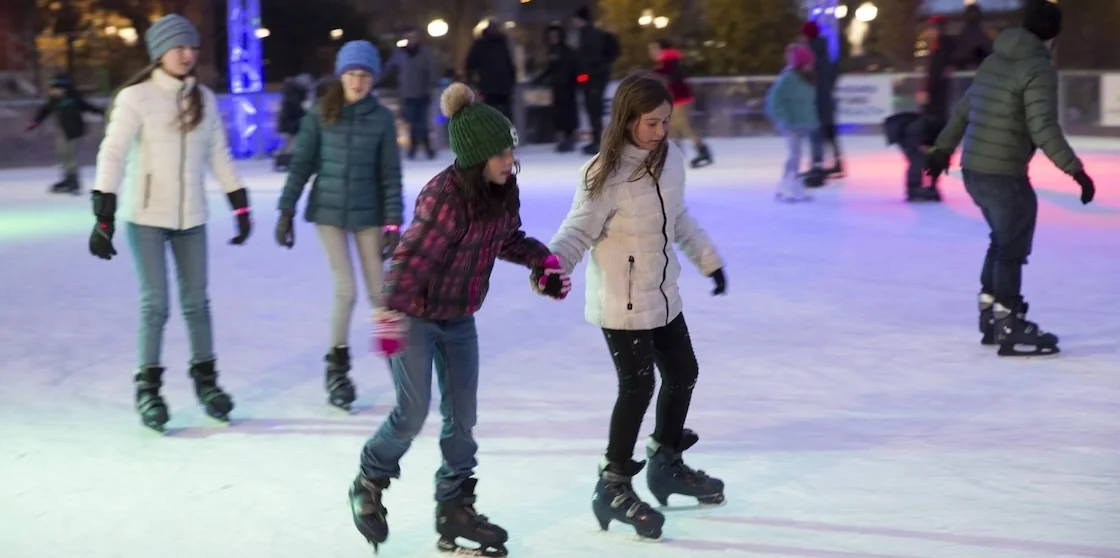 snow sports - two girls ice skating at The Rink at Royal Oak