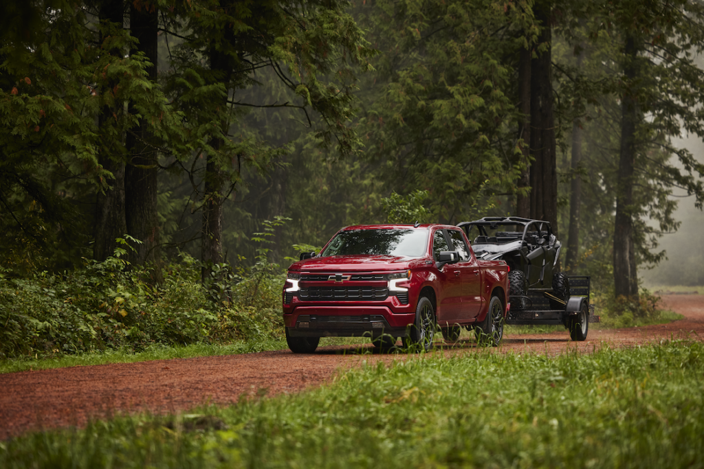 Radiant Red Silverado towing a UTV