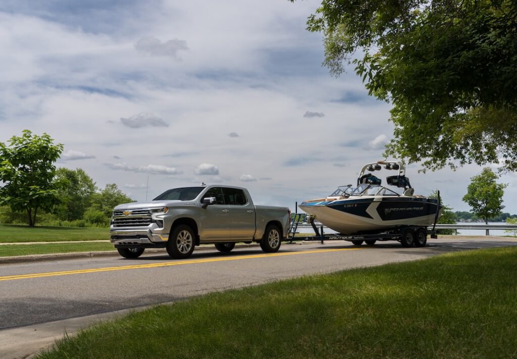 Silver Silverado towing a boat