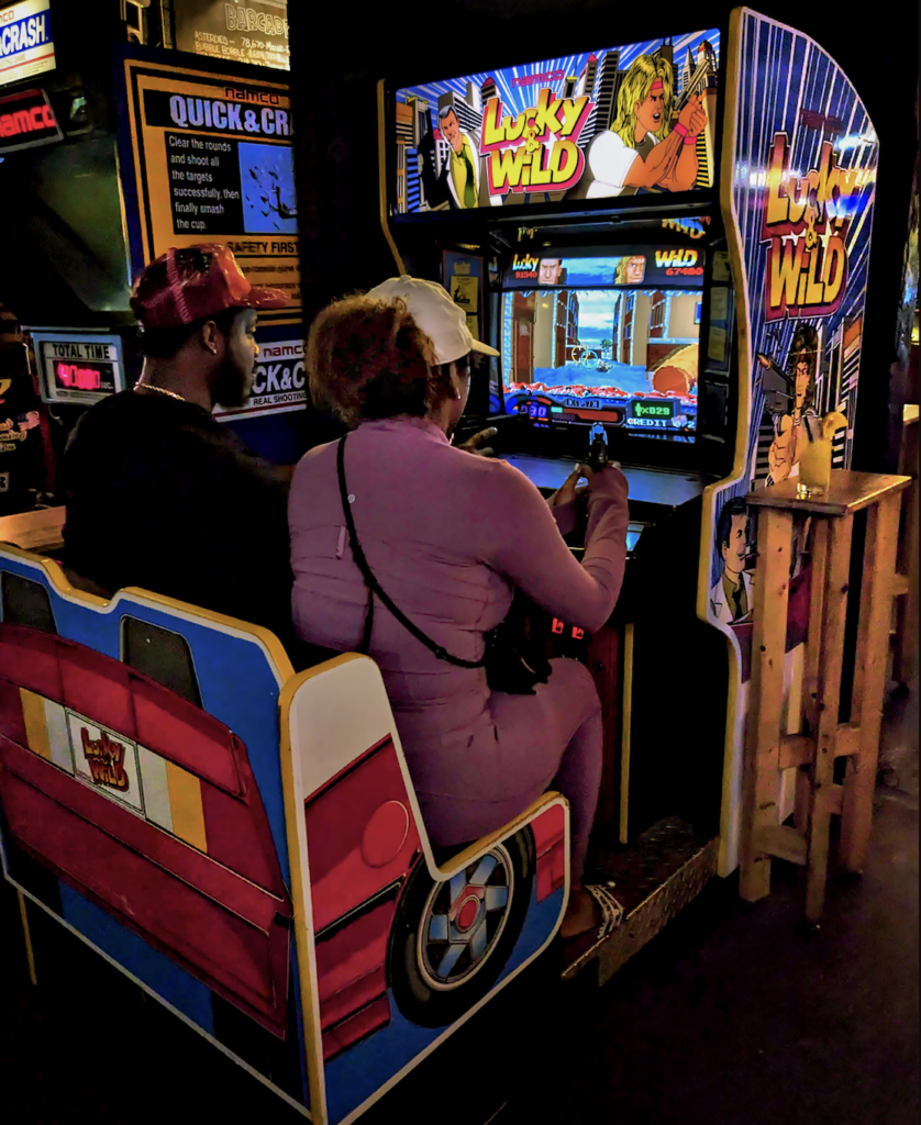 Couple playing a multiplayer game at Barcade Detroit