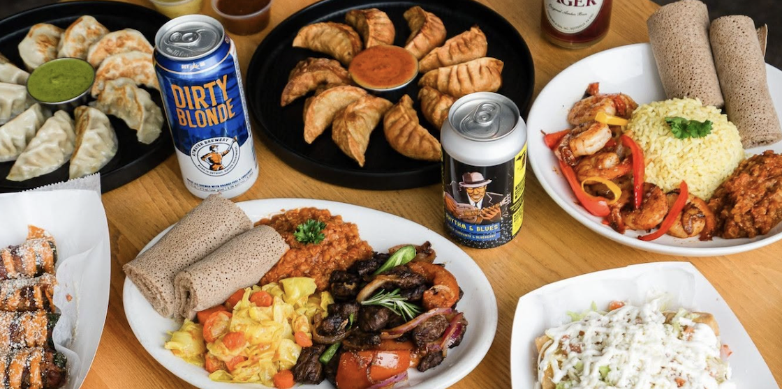 Detroit food hall - Detroit Shipping Company spread of dumplings, Ethiopian cuisine, rice, and more